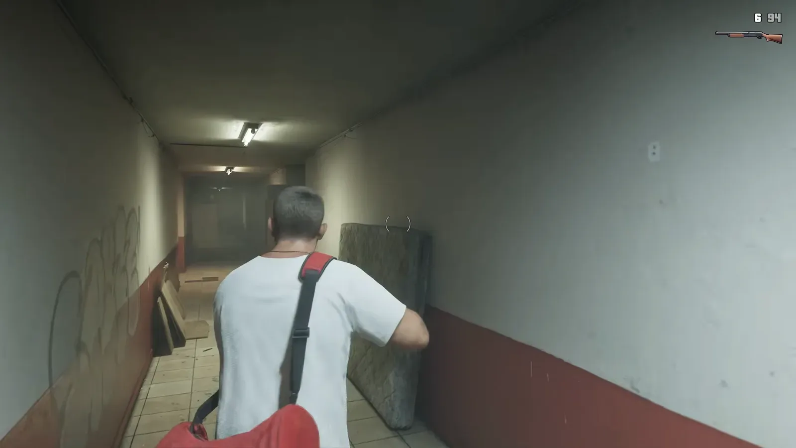 GTA 6 Extended Look: Jason walks a motel corridor with a shotgun drawn, a bracket reticle in the center and a pump shotgun icon with 6 and 94 at top right