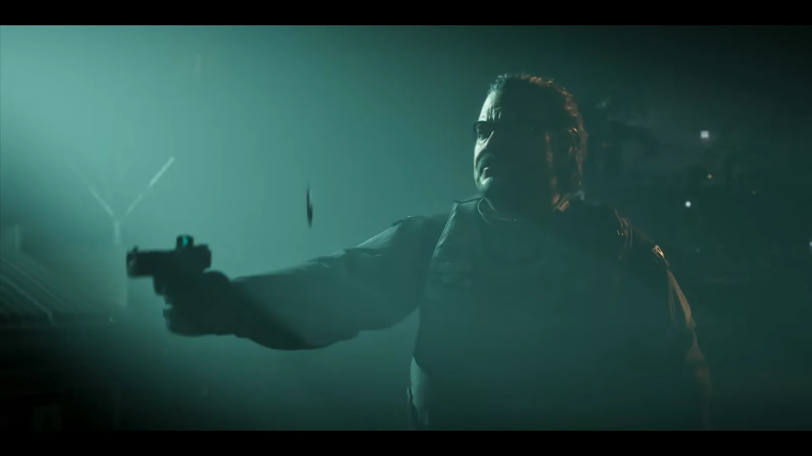 GTA 6 Launch Trailer: a heavy-set man in glasses and a uniform fires a pistol with a red-dot sight in green fog, a casing in the air