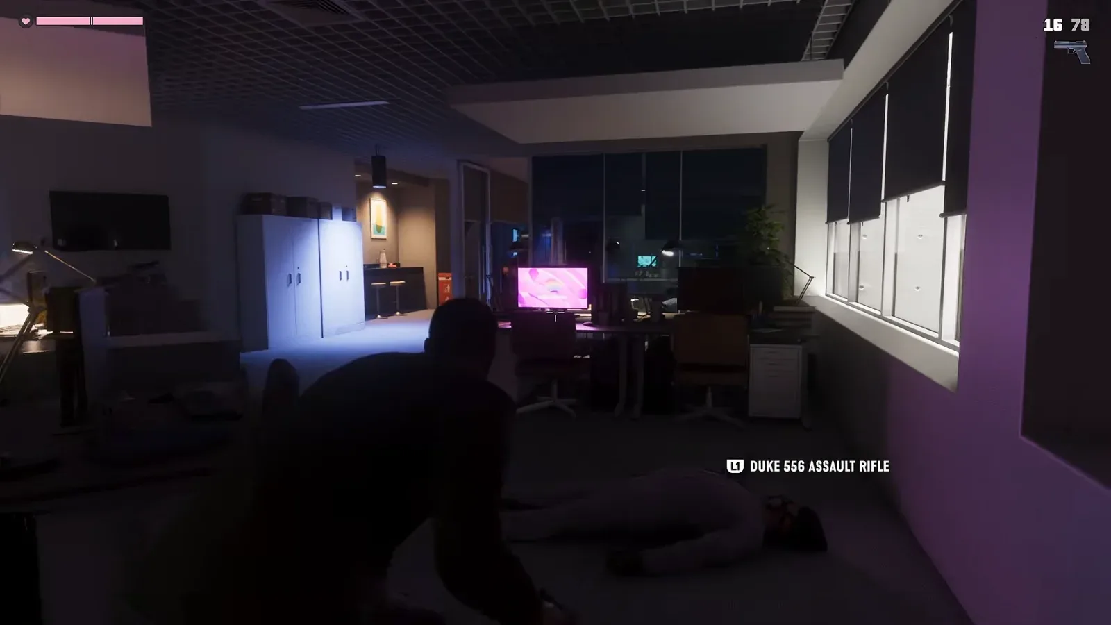 GTA 6 Extended Look: Jason crouches in a dark office beside a body as an L1 prompt reads DUKE 556 ASSAULT RIFLE, a pistol at 16 and 78 on the HUD