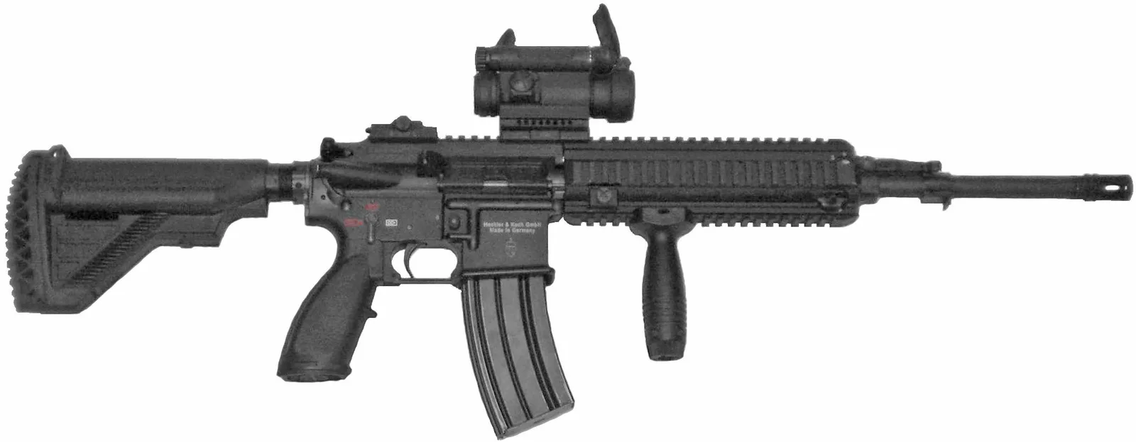 A real Heckler & Koch HK416 rifle of the Norwegian Army with a red-dot sight and vertical grip, left side view, on white