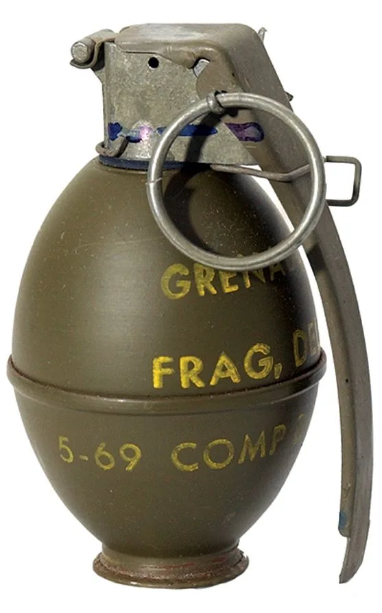 A real US M61 fragmentation hand grenade, olive drab with yellow markings, pin and lever in place, on white