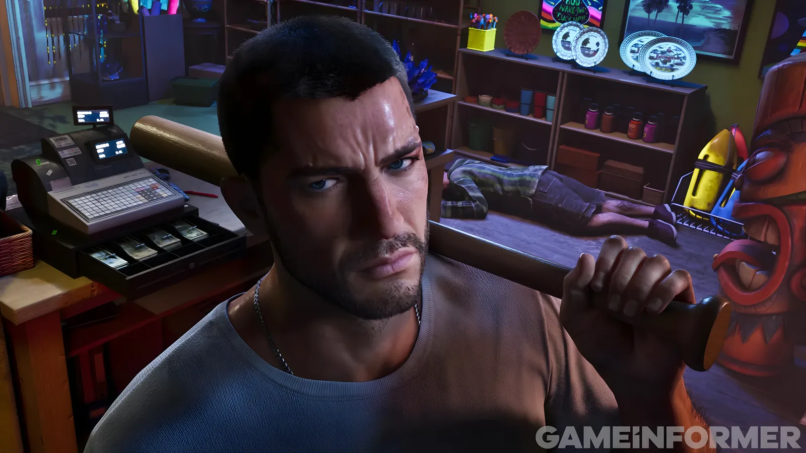 Jason Duval with a baseball bat on his shoulder beside an open cash register, a clerk lying on the floor behind him, Game Informer's exclusive GTA 6 screenshot