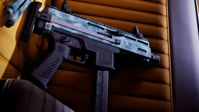Close-up of a compact submachine gun finished in a blue palm-leaf pattern resting on a car seat, from an official GTA 6 screenshot