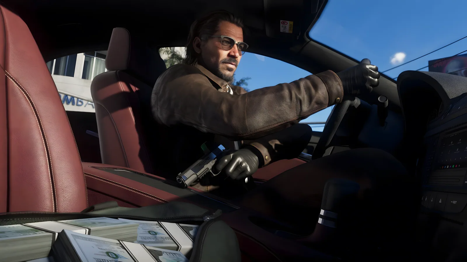 Raul Bautista drives with a silver pistol held low in his gloved hand and stacks of cash on the seat, official GTA 6 screenshot