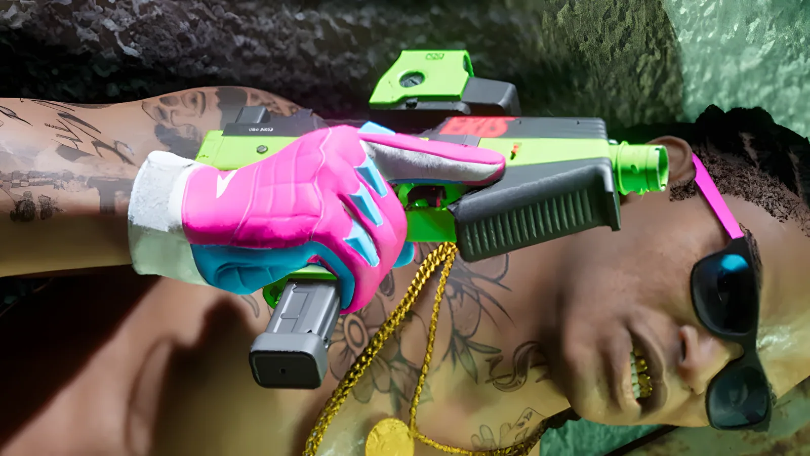 Overhead close-up of a tattooed man in sunglasses holding a bright green and pink compact submachine gun, from an official GTA 6 screenshot